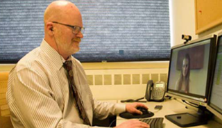 Marc Avery Conducting a Telepsychiatry Session With a Patient Marc Avery Conducting a Telepsychiatry Session With a Patient